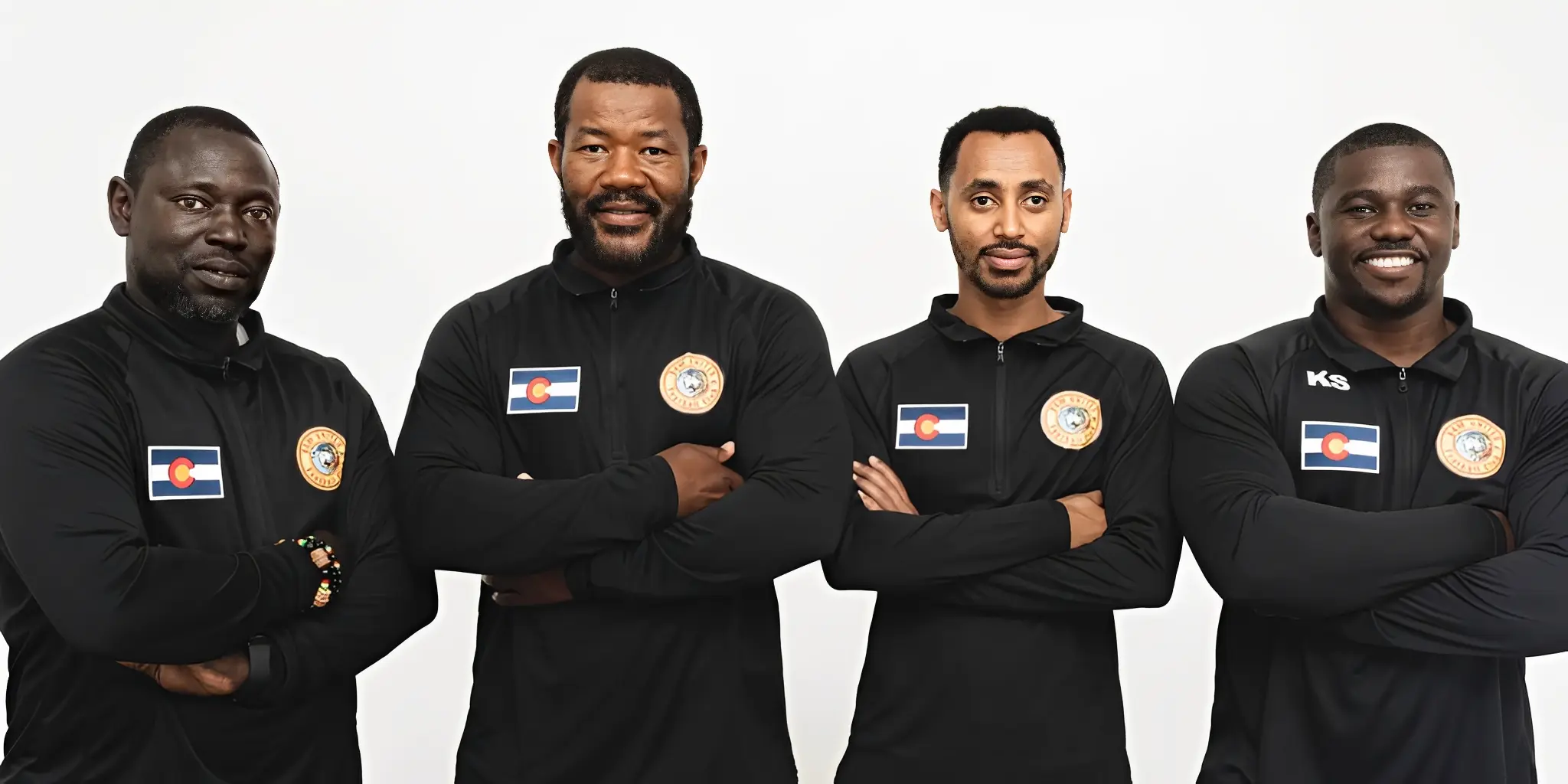 Team members posing confidently together