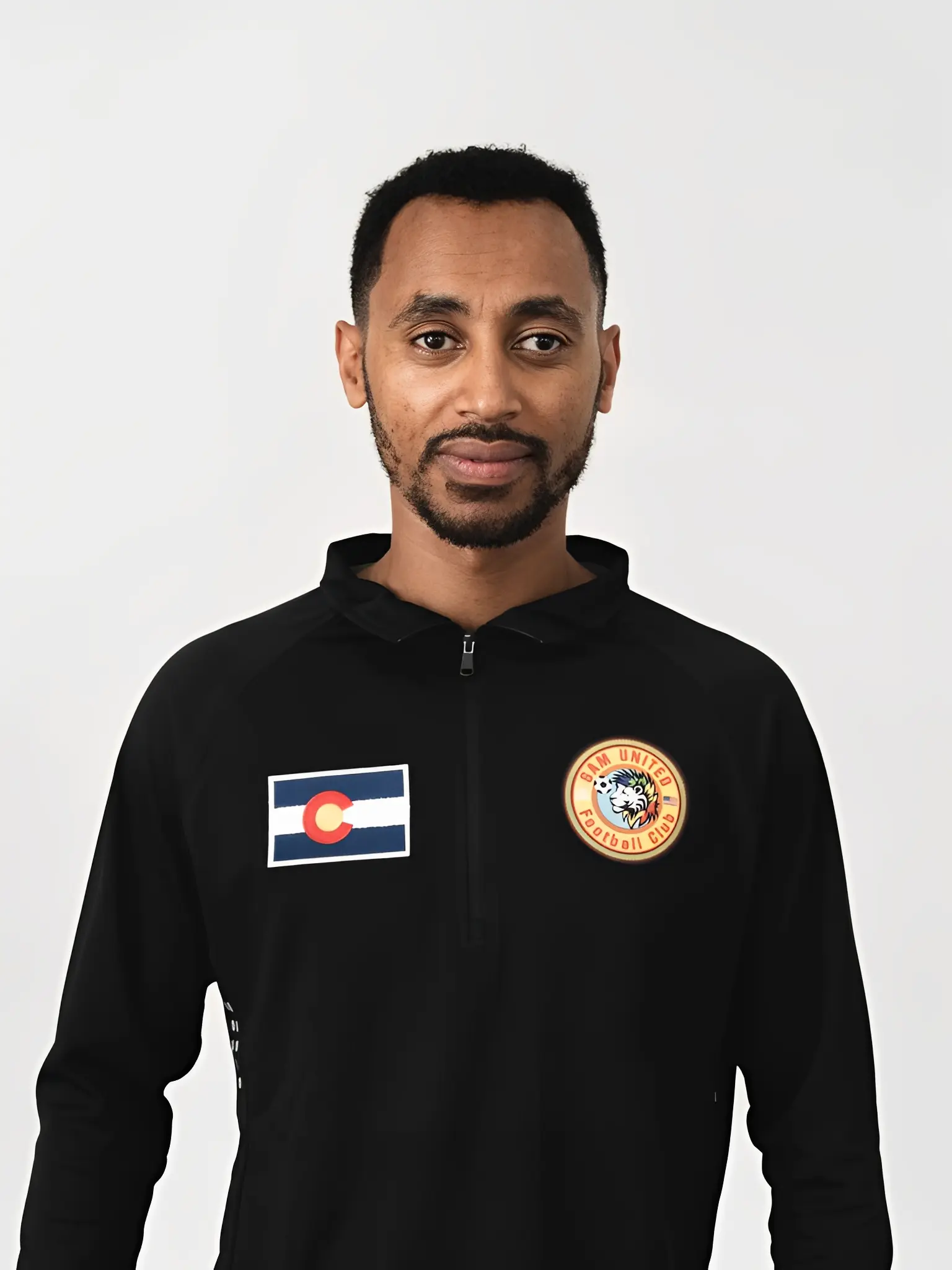 Person in sports jacket with logos
