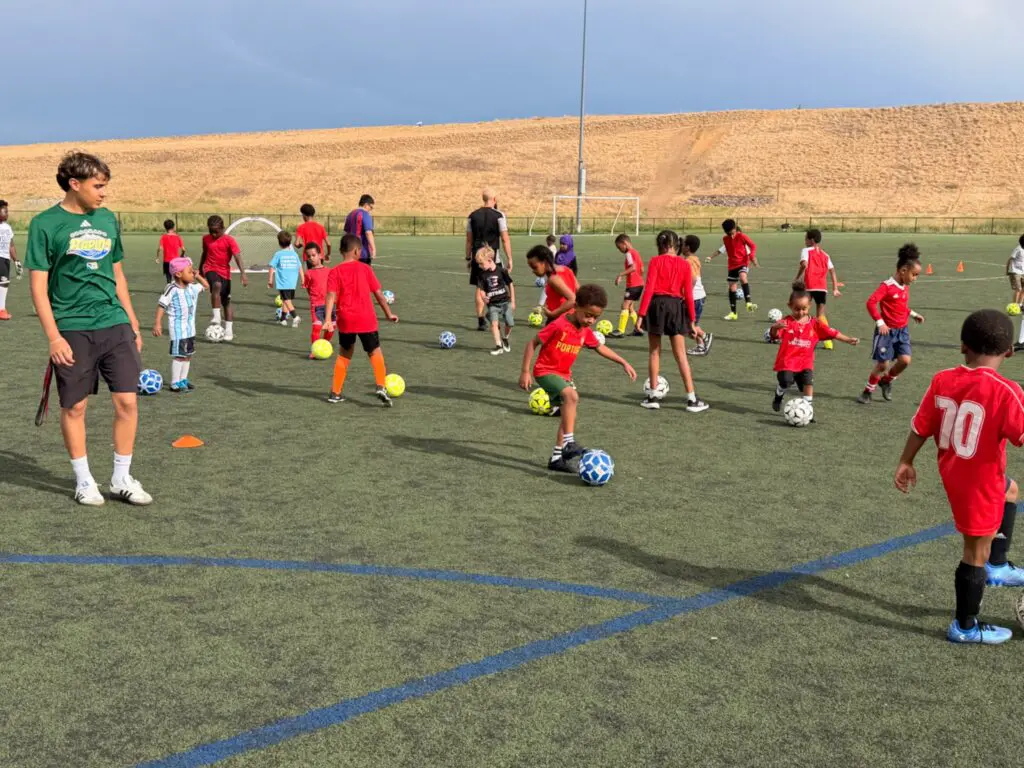 Children participating in the GAM United FC and Colorado Rapids youth soccer clinic